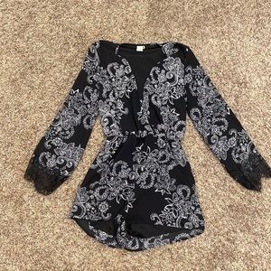 Size small black and white long sleeve romper